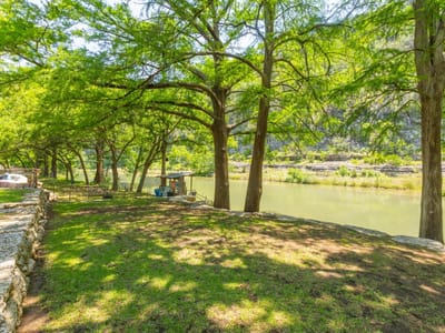 Primary bedroom at 8560 River Rd - SCENIC VALLEY, New Braunfels, TX