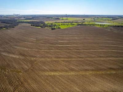 Aerial view with extensive acreage and rolling terrain at 901 County Road 398 - Taylor Transitional 2, Taylor, TX