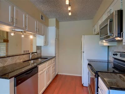 Living area at 908 Poplar St Unit #203 - 3 bed 2 bath home