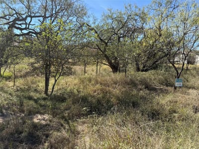 Primary bedroom at Lot 187 Longmont St - Royal Oaks Country Club, Kingsland, TX