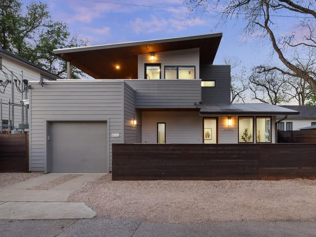 Modern two-storey exterior at 1605 Willow Street in East Austin at dusk