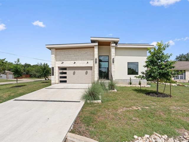 View 21408 Lakefront DR 21408 Lakefront DR - property photo 1 - Luxury home in Lago Vista, TX