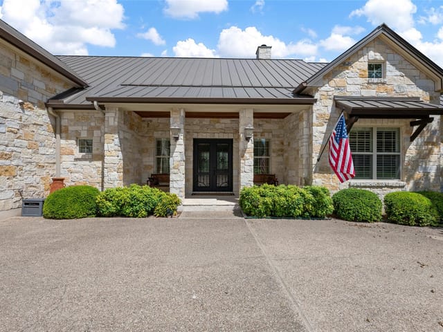 View 27017 Masters Parkway 27017 Masters Parkway - property photo 1 - Luxury home in Spicewood, TX