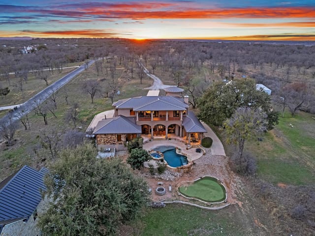 View 303 Yaupon DR 303 Yaupon DR - property photo 1 - Luxury home in Spicewood, TX
