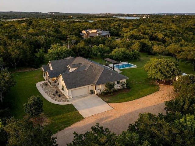 View 335 Turkey Tree RD 335 Turkey Tree RD - property photo 1 - Luxury home in Spicewood, TX