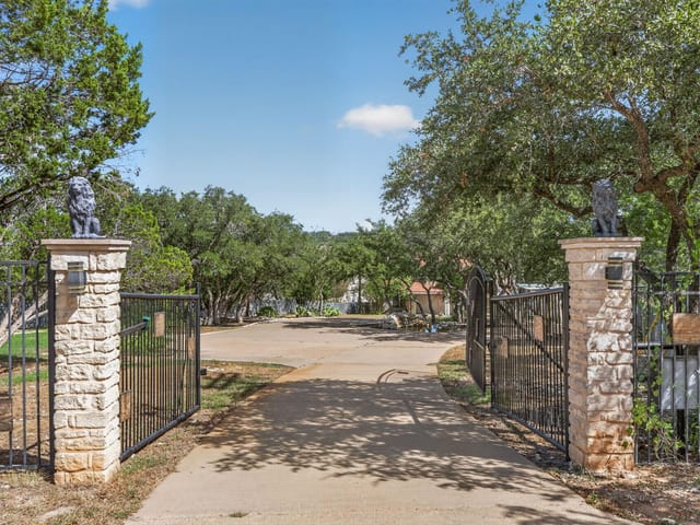 View 3405 Bee Creek RD 3405 Bee Creek RD - property photo 1 - Luxury home in Spicewood, TX