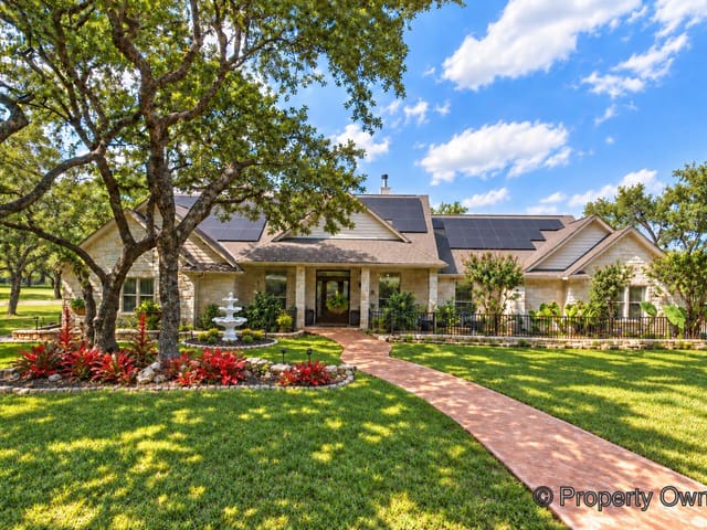 View 400 Bedford DR 400 Bedford DR - property photo 1 - Luxury home in Spicewood, TX
