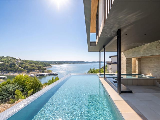 View 629 Casasanta TRL in Rough Hollow The Peninsula 629 Casasanta TRL - front exterior - Luxury home in Rough Hollow The Peninsula, Austin, TX