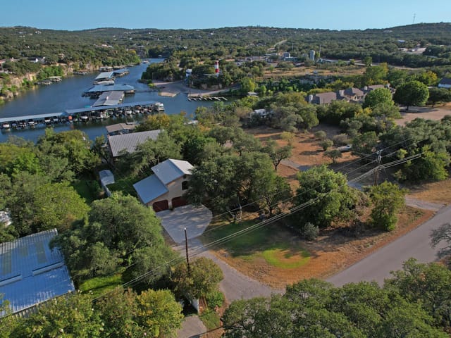View 707 Cat Hollow Club DR 707 Cat Hollow Club DR - property photo 1 - Luxury home in Spicewood, TX