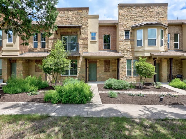 View 7505 Sugar Magnolia ST in CRESTVIEW TOWNHOMES 7505 Sugar Magnolia ST - front exterior - Luxury home in CRESTVIEW TOWNHOMES, Austin, TX