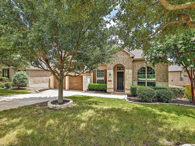 View 7801 Turnback Ledge TRL 7801 Turnback Ledge TRL - property photo 1 - Luxury home in Lago Vista, TX