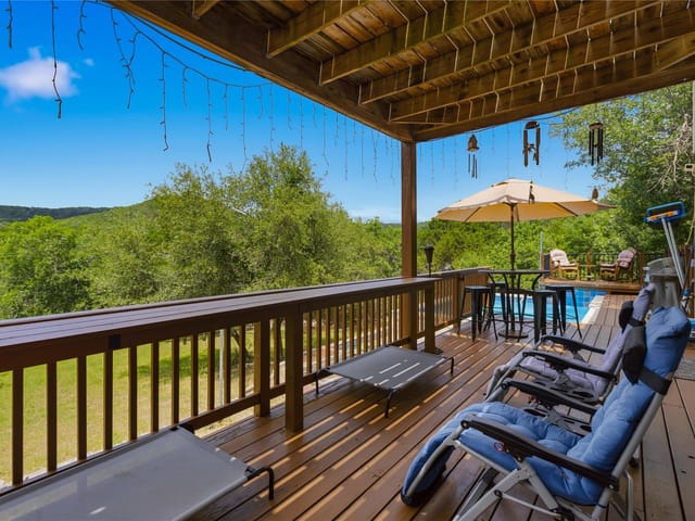 View 8122 Lime Creek RD 8122 Lime Creek RD - property photo 1 - Luxury home in Volente, TX