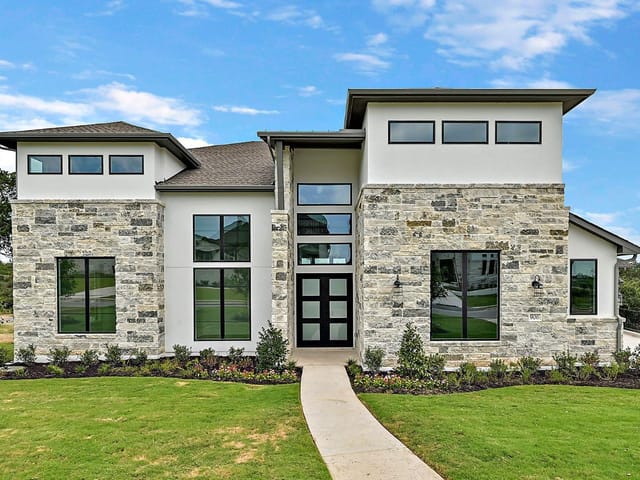 View 906 Bristol Creek BND in Rough Hollow 906 Bristol Creek BND - front exterior - Luxury home in Rough Hollow, Lakeway, TX