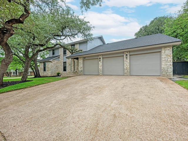 View 9401 Topridge DR 9401 Topridge DR - property photo 1 - Luxury home in Austin, TX